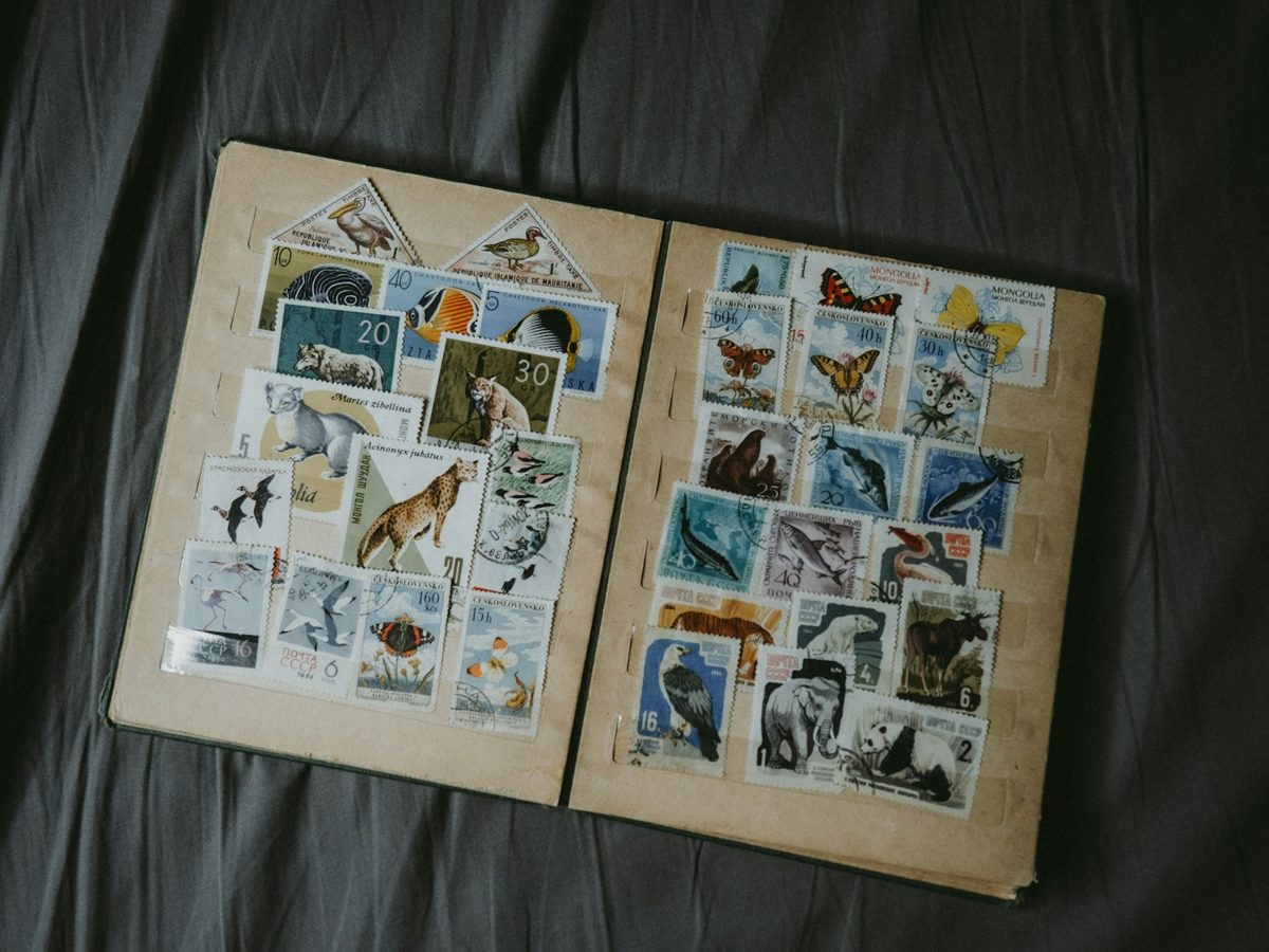 A stamp album open to two full pages